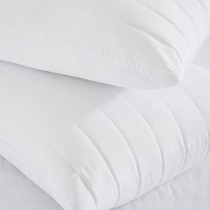 A close up image of two Silentnight Anti-Allergy Pillow Protectors stacked on top of one another to show the detail