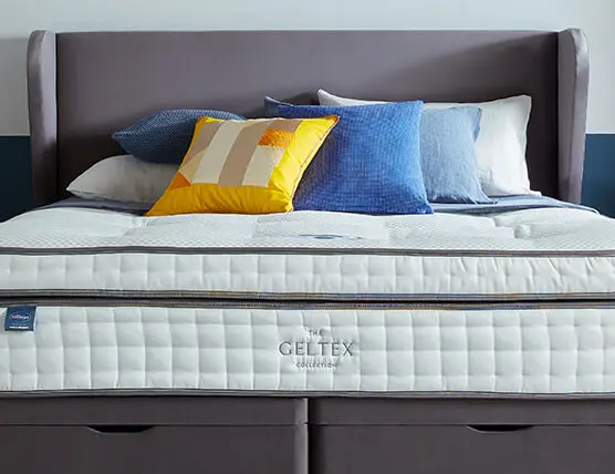 Geltex mattress on divan bed with headboard, pilows and cusions