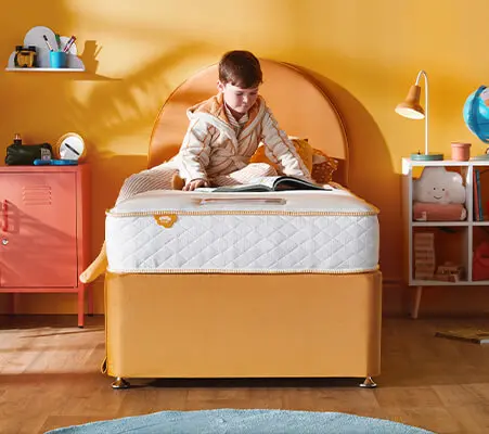 Young child's first junior bedroom with divan storage bed and kids mattress