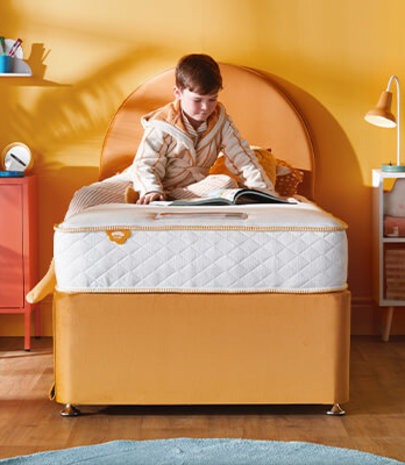 Young child's first junior bedroom with divan storage bed and kids mattress