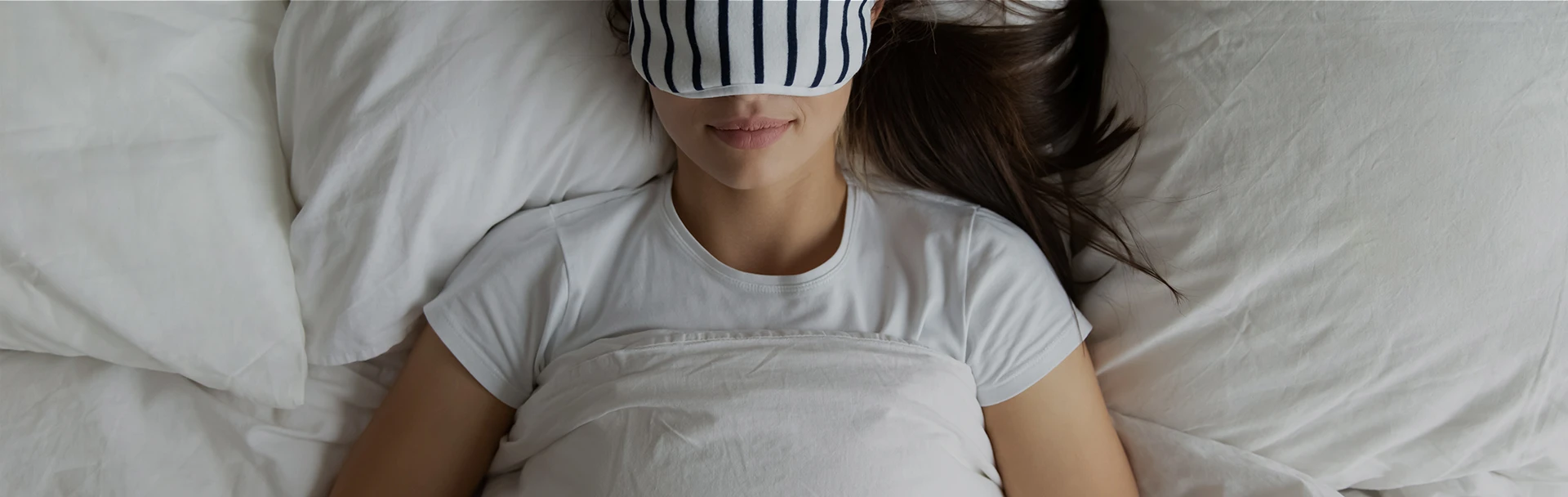 Woman with sleep mask - healthy sleep guide
