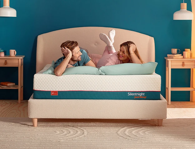 Couple lying on a just serene mattress