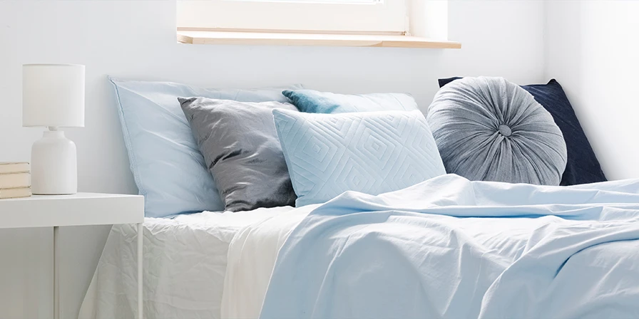 bed room with blue bedding