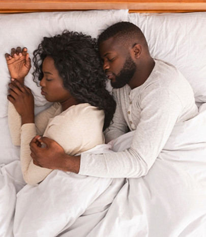 Couple sleeping cosily together