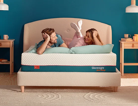 Man and woman lying on a silentnight just sleep serene mattress 
