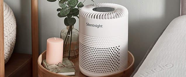 air purifier on bedside table